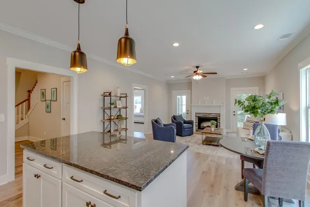 a kitchen with sink and chandelier