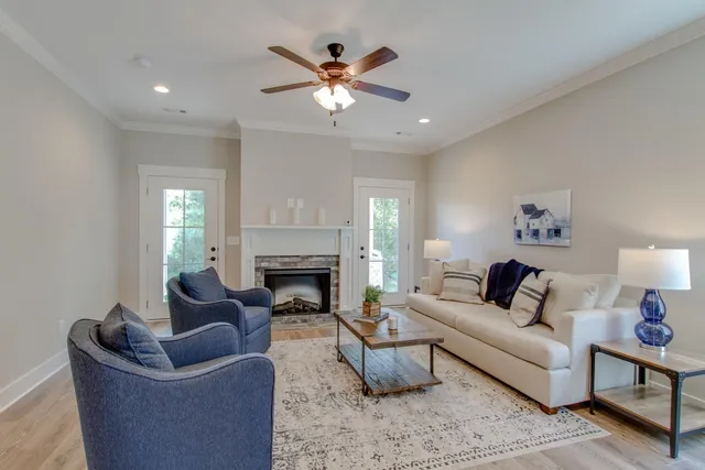 a living room with furniture and a fireplace