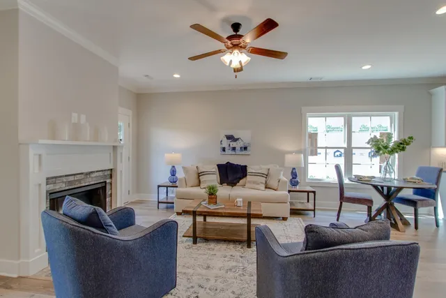 a living room with furniture and a fireplace