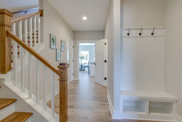 a view of an entryway with wooden floor