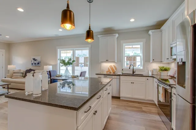 a kitchen with counter top space cabinets and appliances
