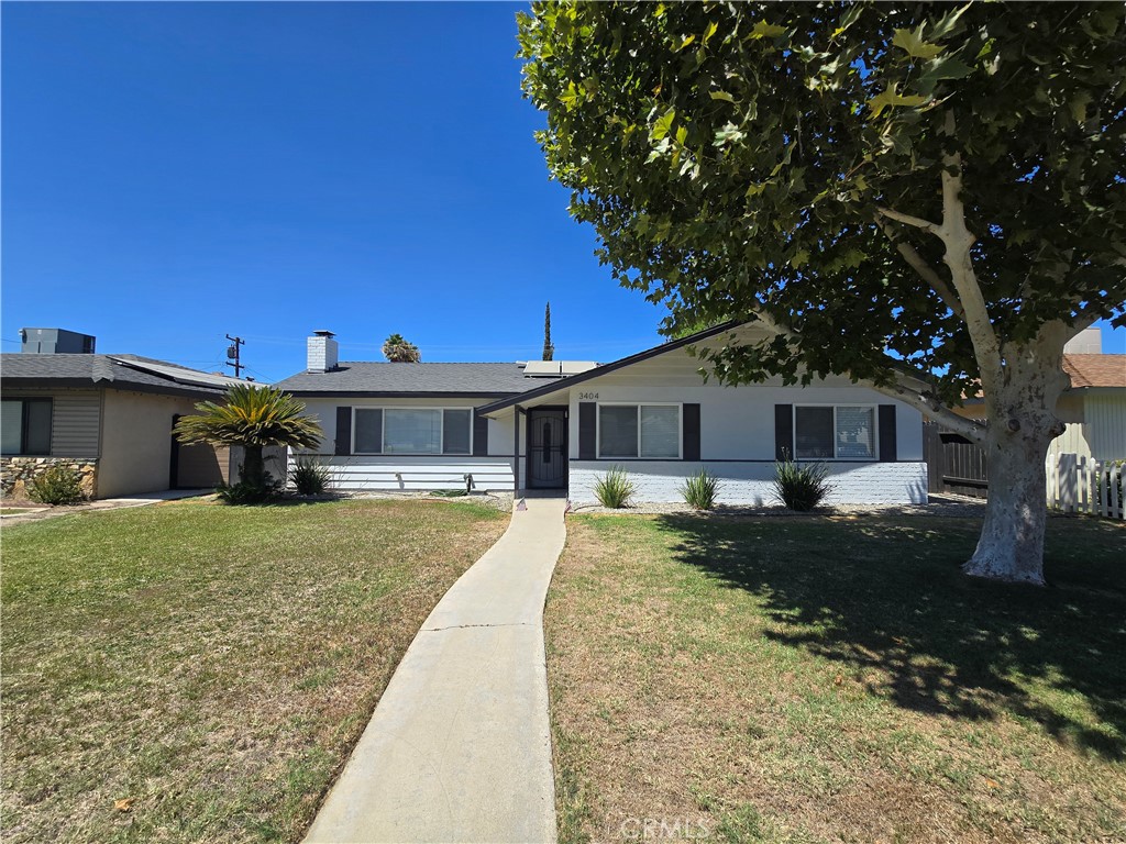 3404 Planz Road Bakersfield, CA 93309 - Photo 1 of 23 a front view of a house with a yard