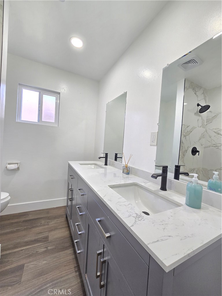 3404 Planz Road Bakersfield, CA 93309 - Photo 13 of 23 a bathroom with a sink and a mirror