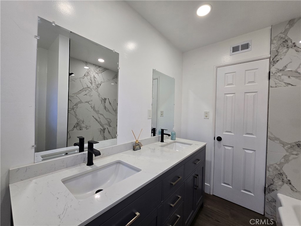 3404 Planz Road Bakersfield, CA 93309 - Photo 19 of 23 a bathroom with a sink and a mirror