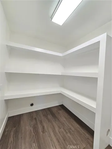 a storage room with a wooden floor