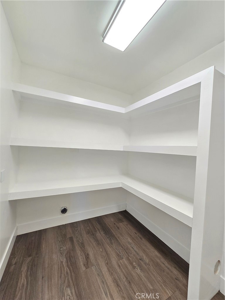 3404 Planz Road Bakersfield, CA 93309 - Photo 5 of 23 a storage room with a wooden floor
