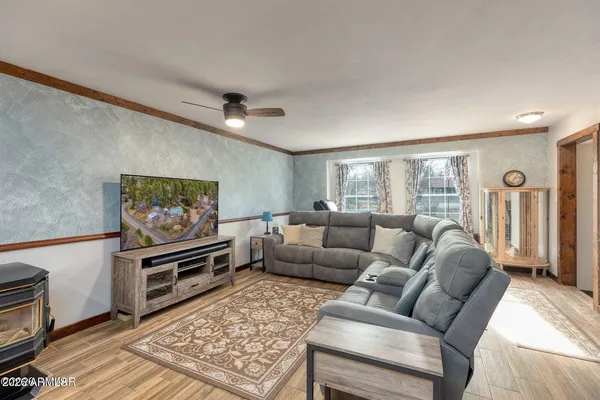 a living room with furniture and a window