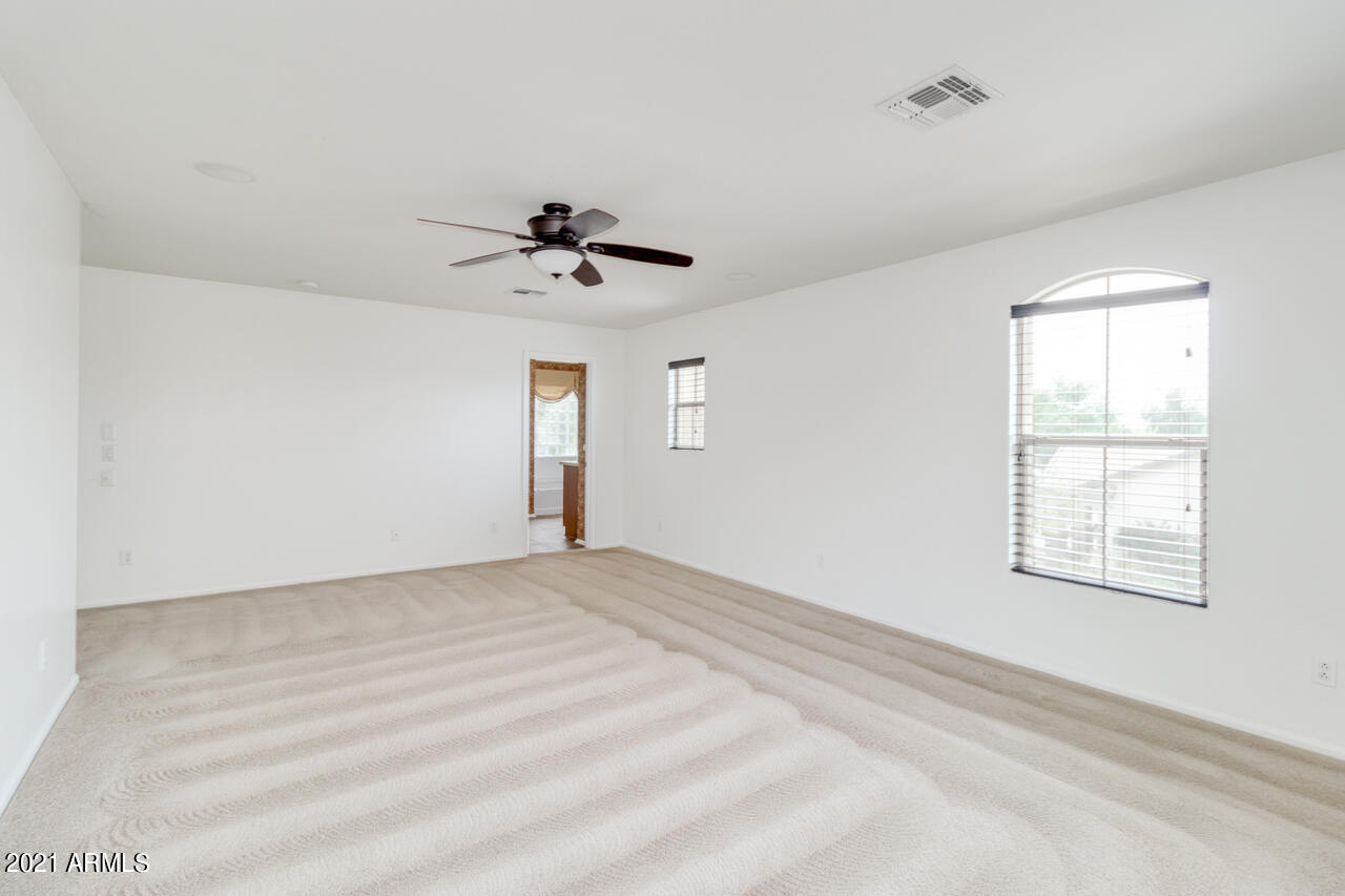 1074 South Hawk Lane Gilbert, AZ 85296 - Photo 18 of 35 a view of an empty room with a window