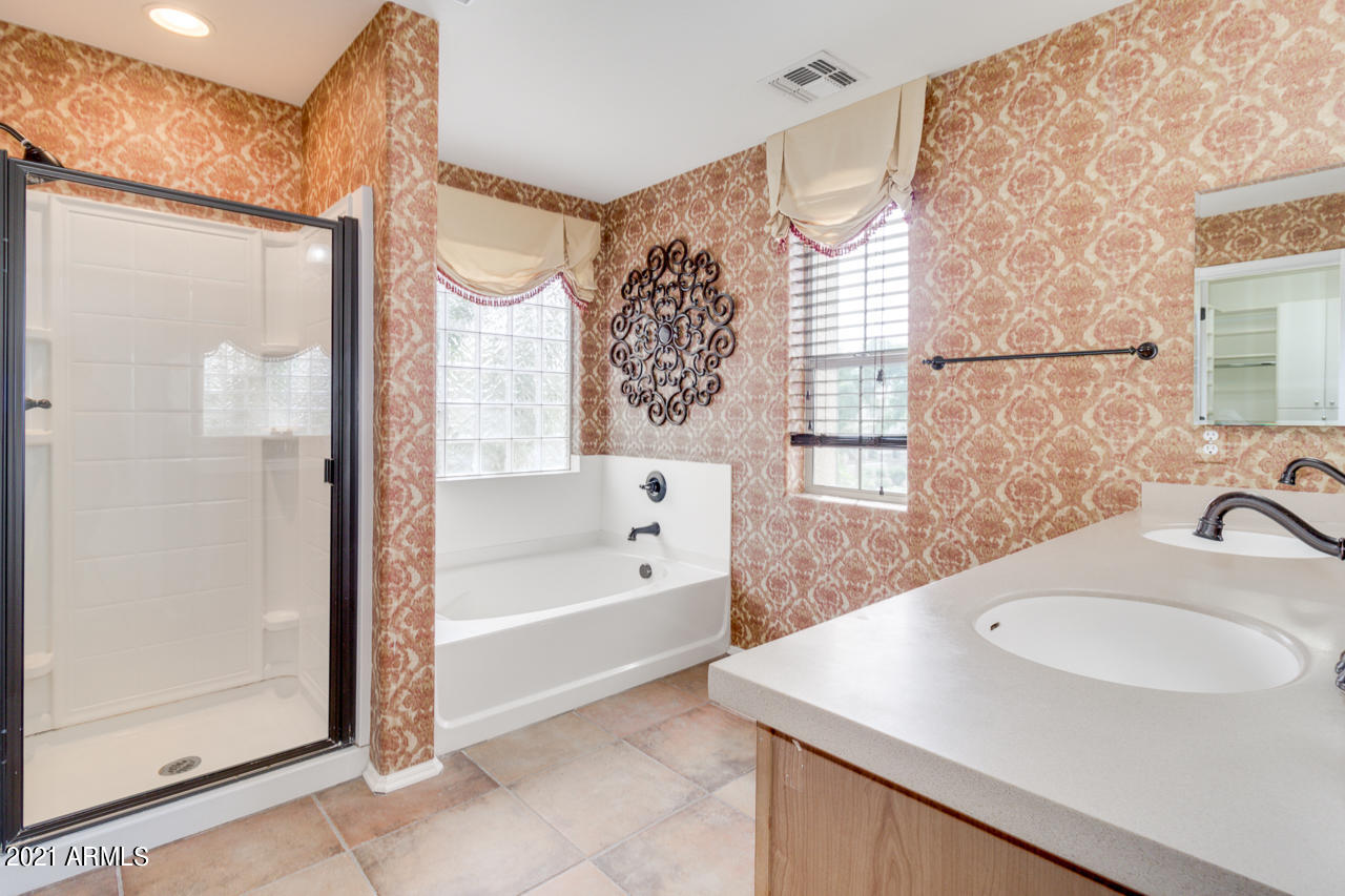 1074 South Hawk Lane Gilbert, AZ 85296 - Photo 20 of 35 a bathroom with a sink and a mirror