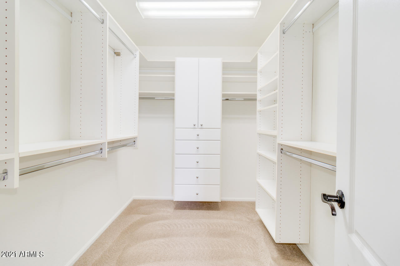 1074 South Hawk Lane Gilbert, AZ 85296 - Photo 22 of 35 a view of walk in closet with empty racks