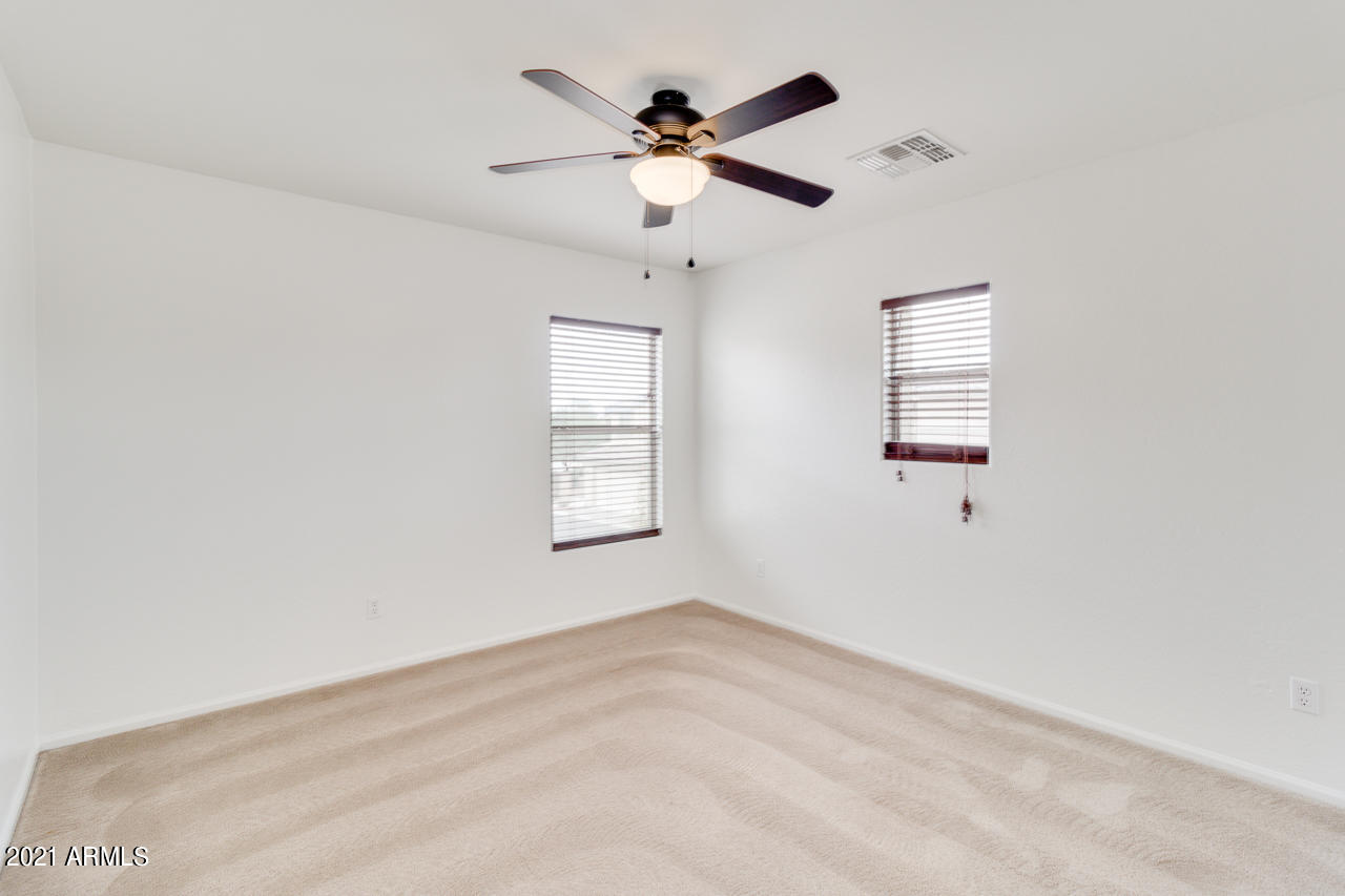 1074 South Hawk Lane Gilbert, AZ 85296 - Photo 23 of 35 wooden floor in an empty room with a window