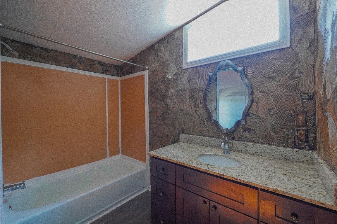 155 5th Street Maxwell, TX 78656 - Photo 24 of 34 a bathroom with a sink and a mirror