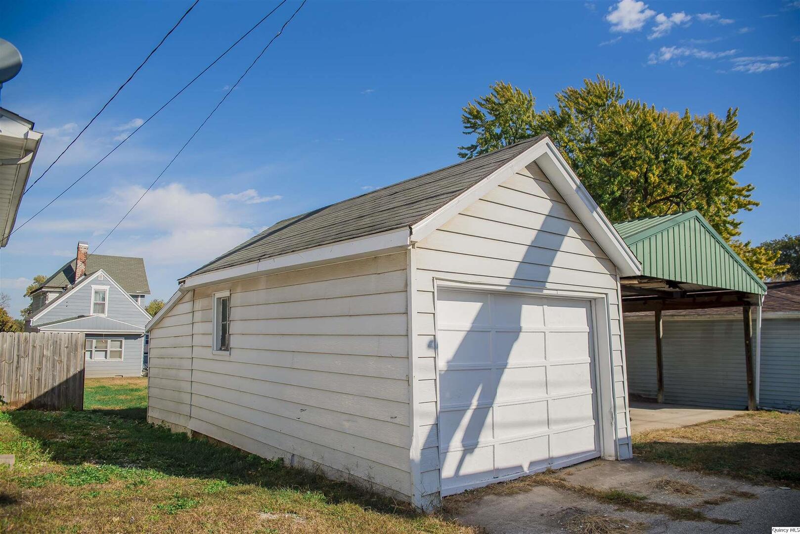 512 Madison Street Quincy, IL 62301 - Photo 15 of 15 a view of a house with a yard