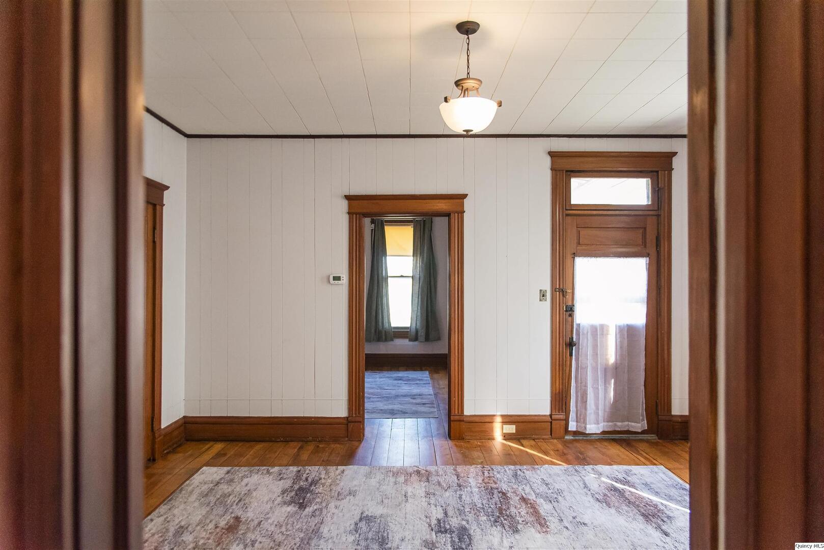 512 Madison Street Quincy, IL 62301 - Photo 10 of 15 a view of hallway with wooden floor