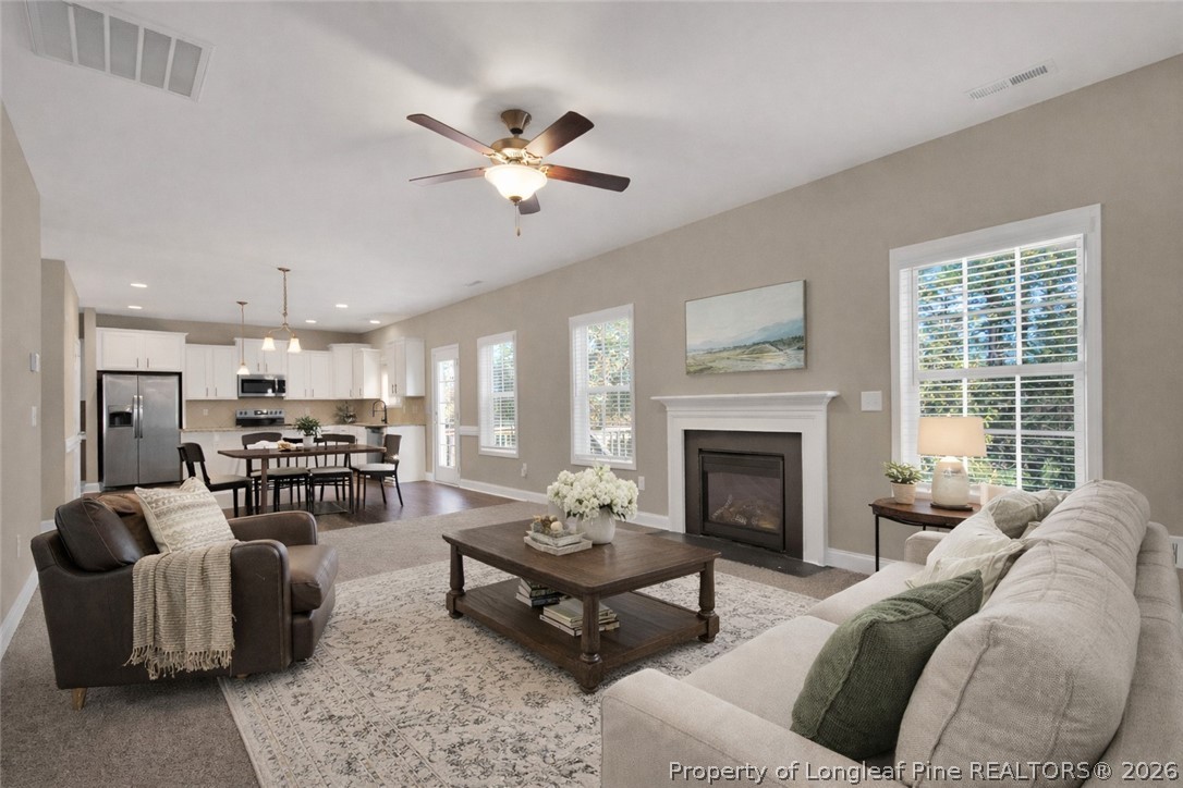 448 Pittfield Run Cameron, NC 28326 - Photo 4 of 43 a living room with furniture fireplace and window