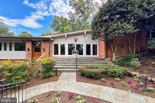 a kitchen with stainless steel appliances granite countertop a stove and cabinets