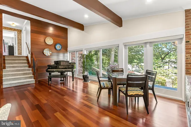 a view of a livingroom with furniture and gym equipment