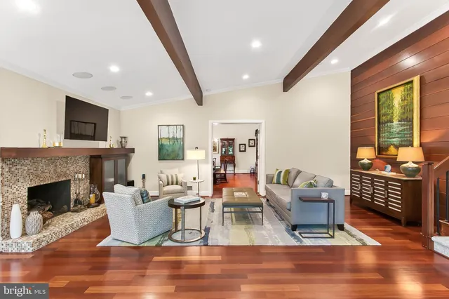 a bathroom with a granite countertop toilet sink and mirror
