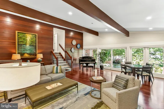 a bathroom with a toilet a sink a mirror and vanity