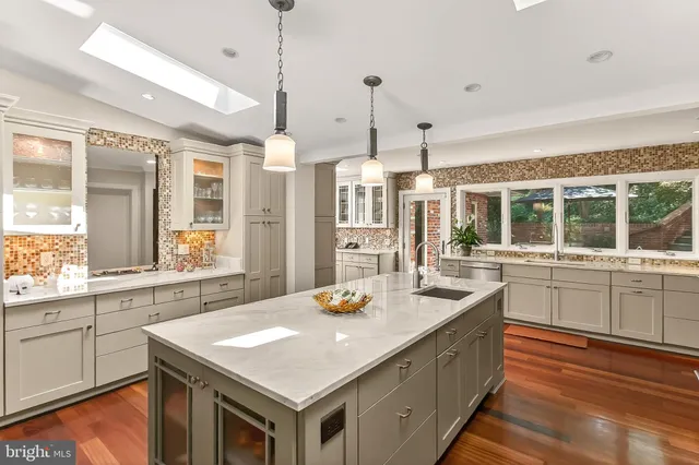 a bathroom with a window and a shower