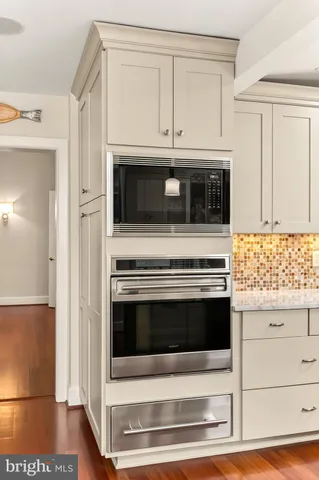 a view of an outdoor sitting area with furniture and wooden floor