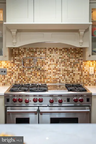 a view of a brick house with a large window