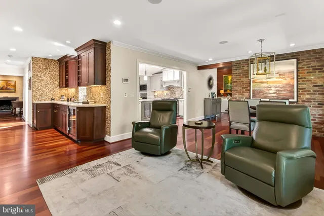 a living room with a flat screen tv and a view of living room