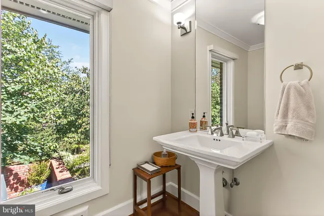 a view of a patio with table and chairs and potted plants