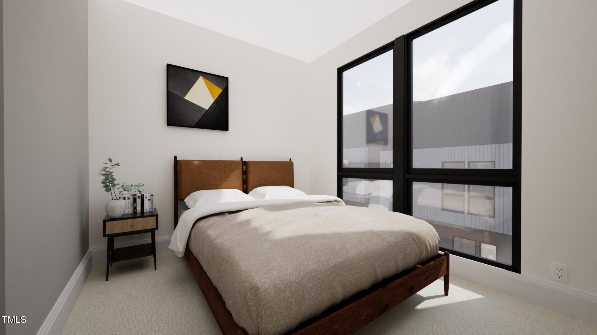 512 Gordon Street, Unit 402 Durham, NC 27701 - Photo 7 of 13 a bedroom with a bed and a painting on the wall