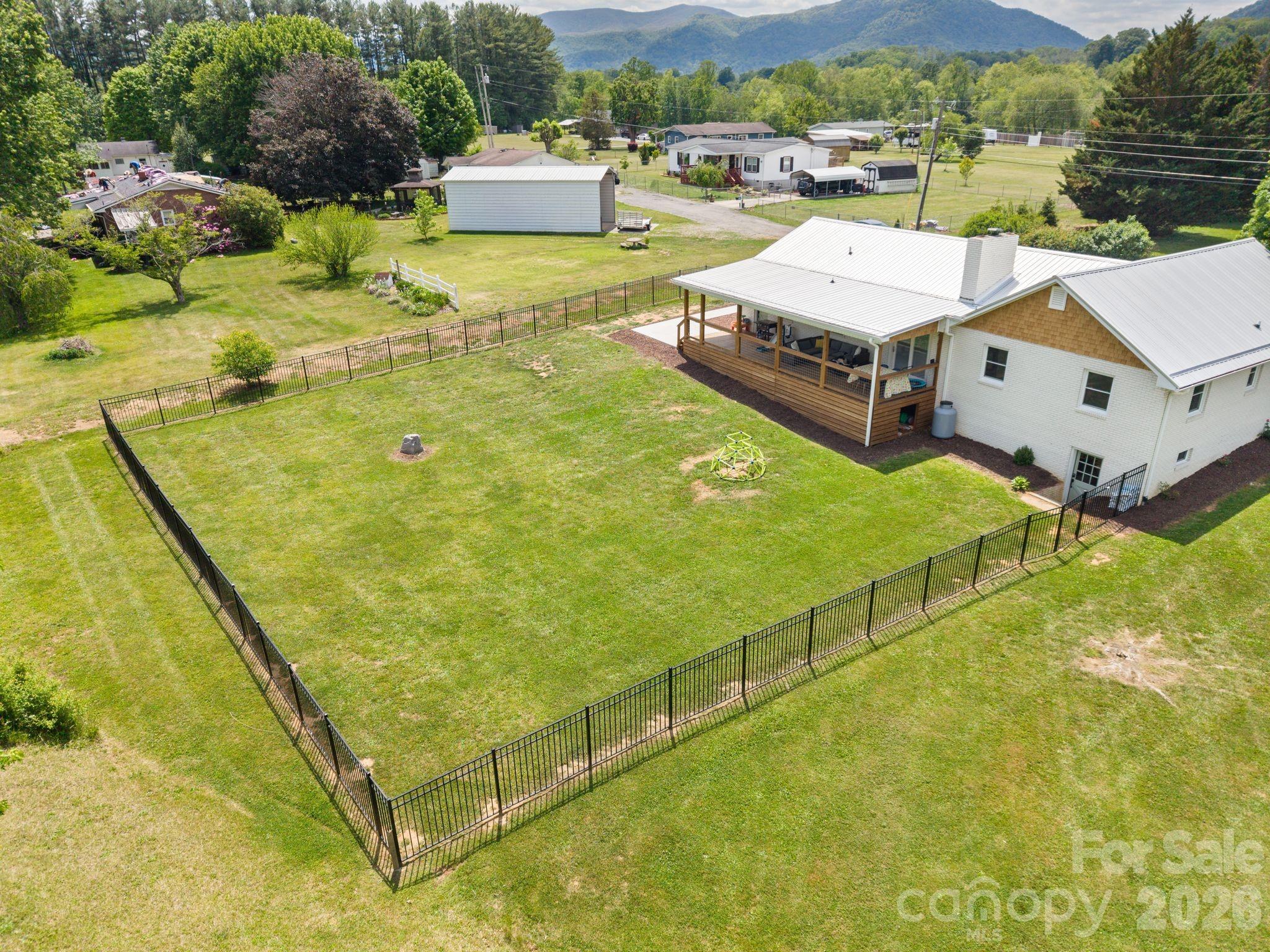 97 Paul Holland Road Canton, NC 28716 - Photo 32 of 35 a swimming pool with outdoor seating and yard