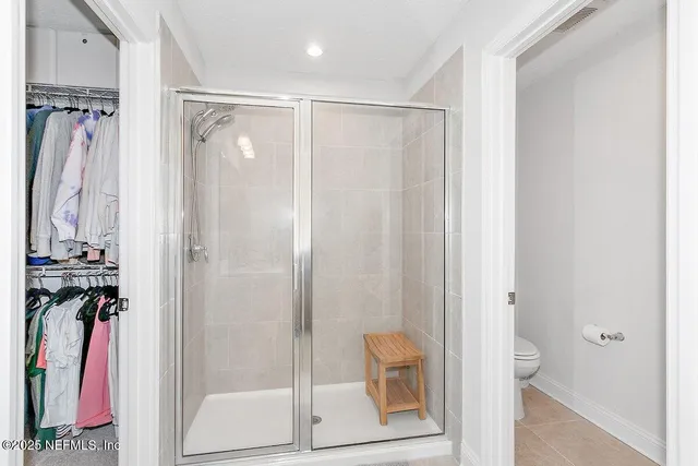 a bathroom with a shower and a sink