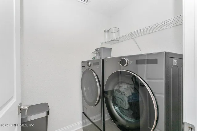 a utility room with dryer and washer
