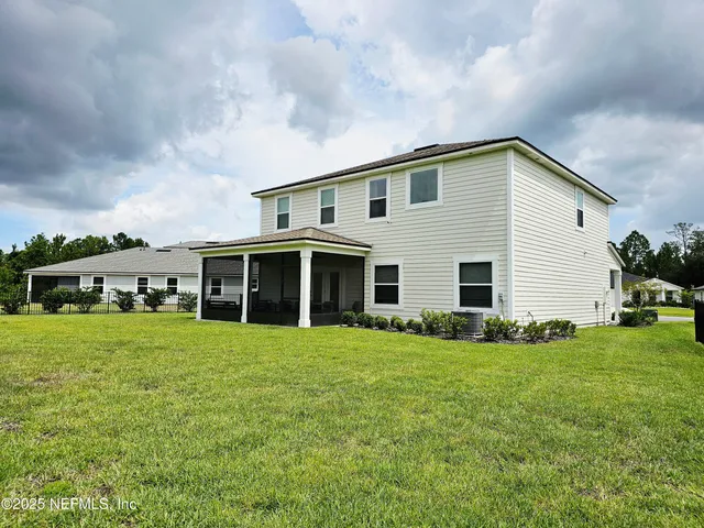 a big house with a big yard and more windows