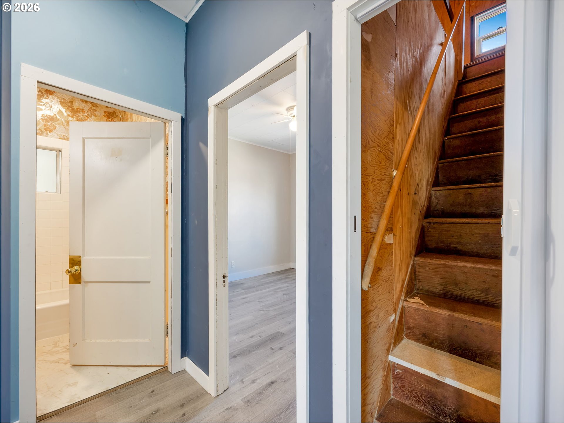 36290 7th Street Nehalem, OR 97131 - Photo 16 of 37 a view of staircase with wooden floor and windows