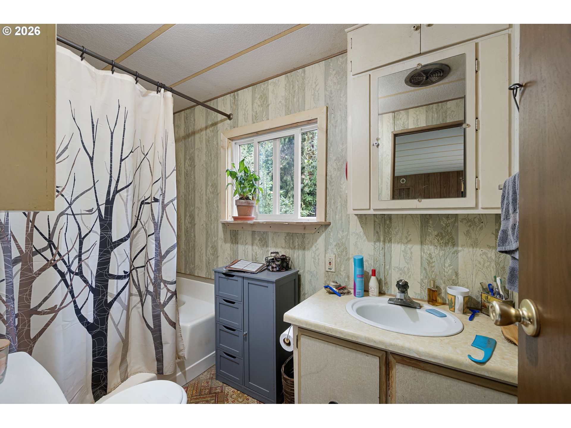 4826 Rhododendron Loop Florence, OR 97439 - Photo 26 of 41 a bathroom with a sink toilet and shower