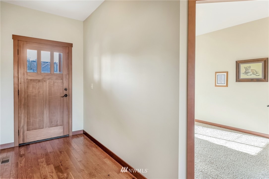 816 Red Maple Loop Everson, WA 98247 - Photo 2 of 22 a view of an empty room with wooden floor