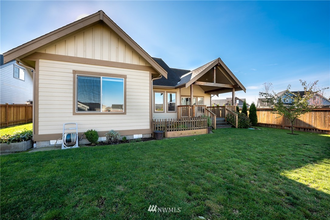 816 Red Maple Loop Everson, WA 98247 - Photo 18 of 22 a front view of house with yard and green space
