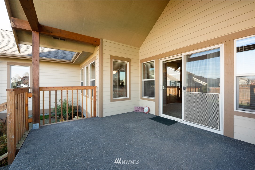 816 Red Maple Loop Everson, WA 98247 - Photo 20 of 22 a view of a porch with wooden floor and fence