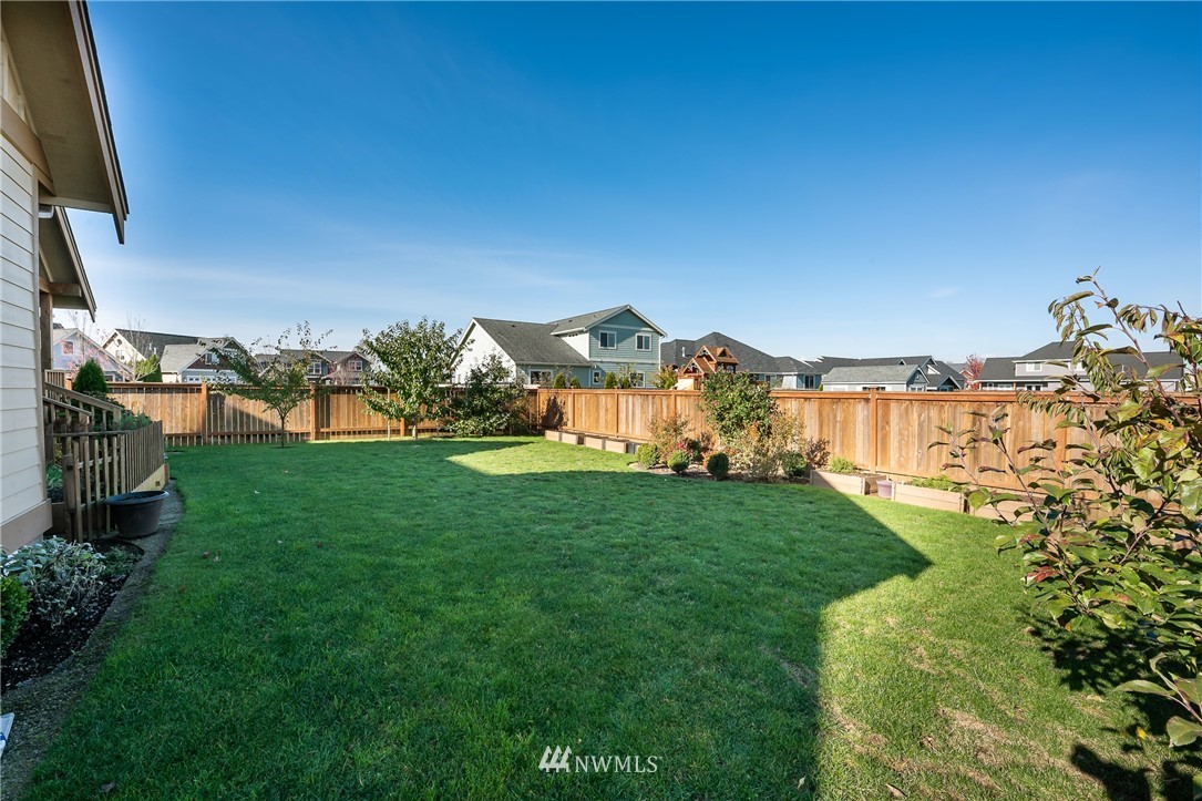 816 Red Maple Loop Everson, WA 98247 - Photo 21 of 22 a view of a big yard with a fountain