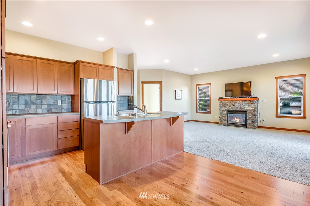 816 Red Maple Loop Everson, WA 98247 - Photo 4 of 22 a living room with stainless steel appliances kitchen island granite countertop a refrigerator and a stove top oven