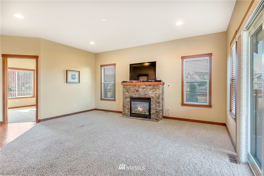 816 Red Maple Loop Everson, WA 98247 - Photo 8 of 22 a view of an empty room with a fireplace