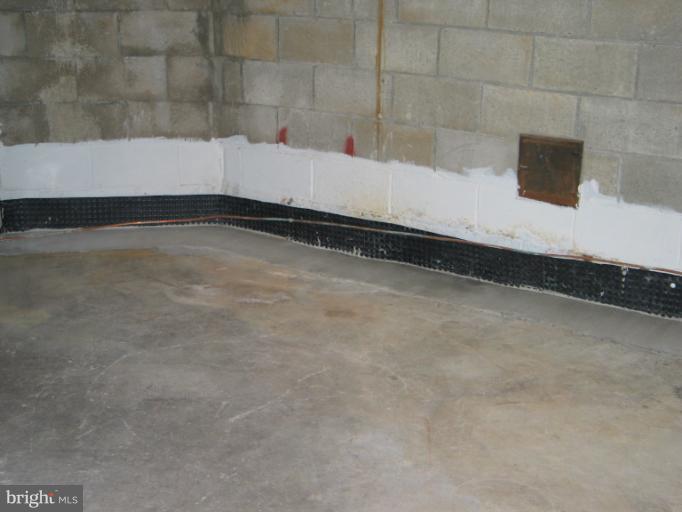 8541 Bay Road Pasadena, MD 21122 - Photo 22 of 28 French Drain in Basement