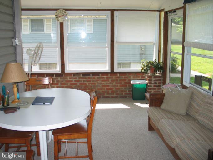 8541 Bay Road Pasadena, MD 21122 - Photo 7 of 28 enclosed porch