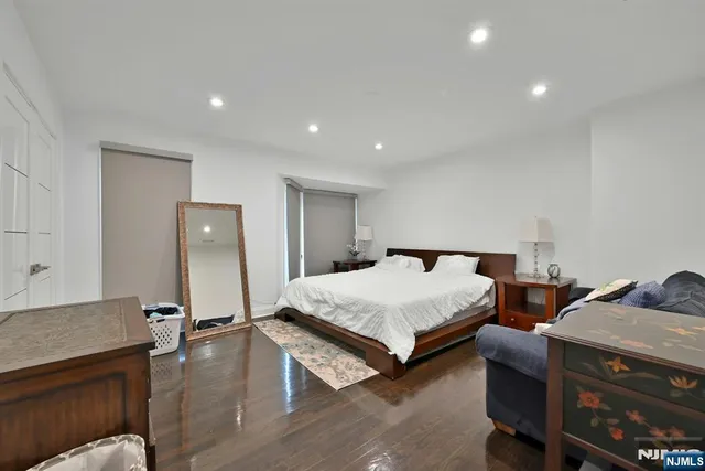 a bedroom with two beds and painted walls