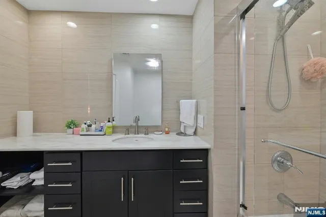 a bathroom with a double vanity sink and mirror