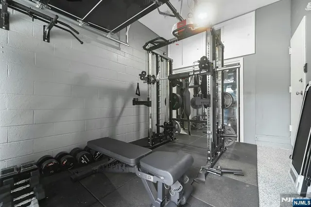 a bathroom with a shower and a sink