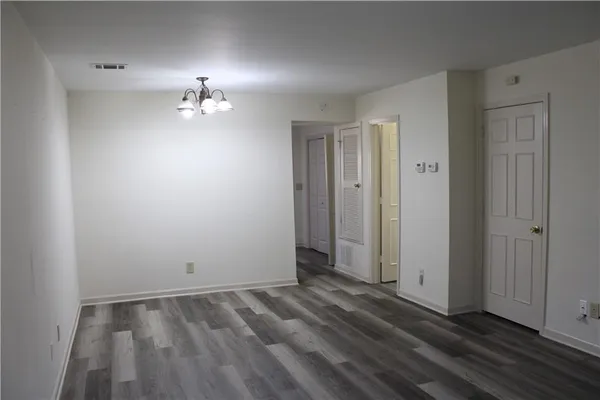 a kitchen with stainless steel appliances a stove a microwave and a refrigerator