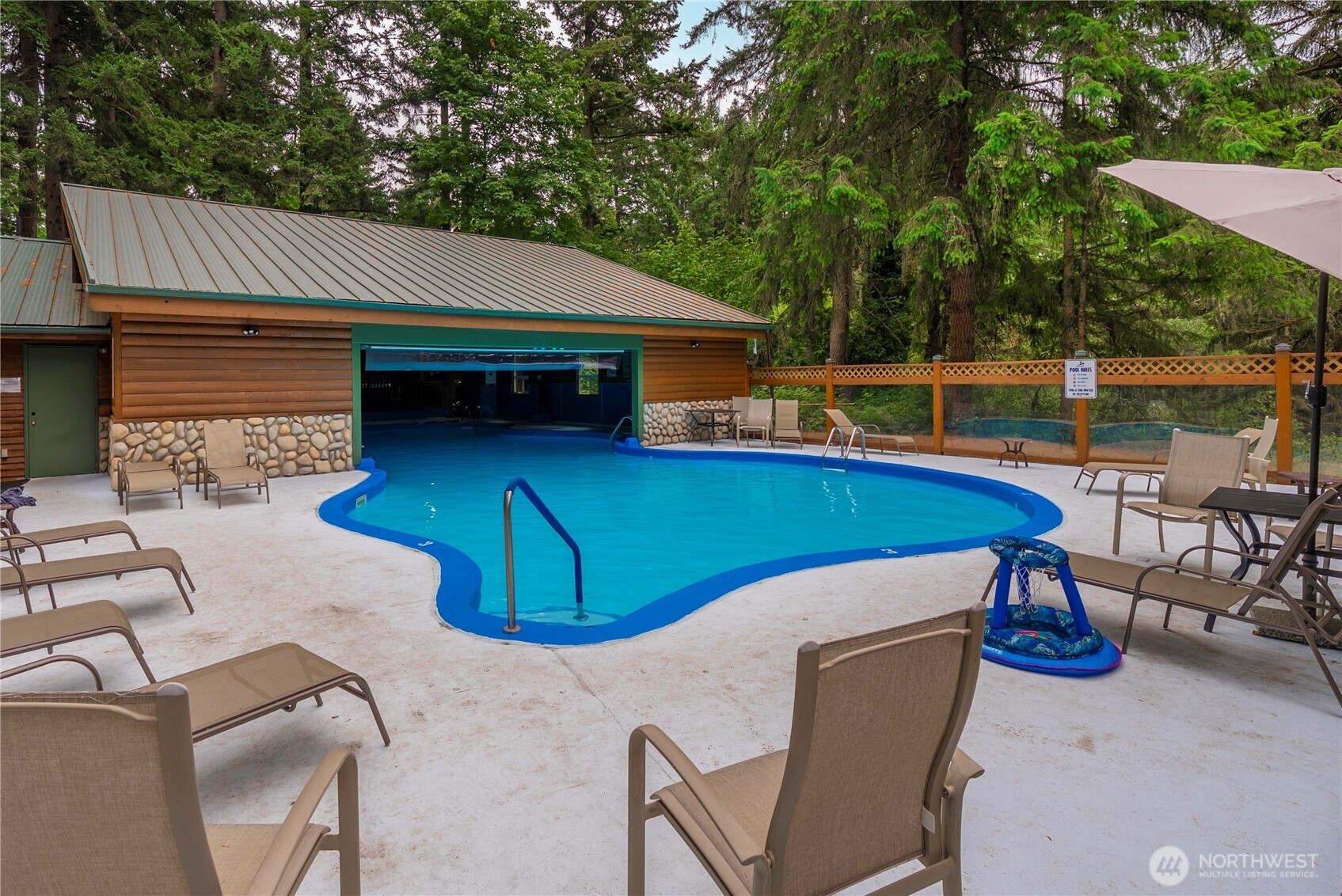1546 Reservation Road Southeast, Unit 62 Olympia, WA 98513 - Photo 20 of 39 a view of backyard with swimming pool and outdoor seating