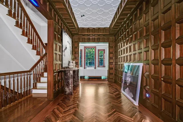 a view of an entryway with wooden floor and stairs