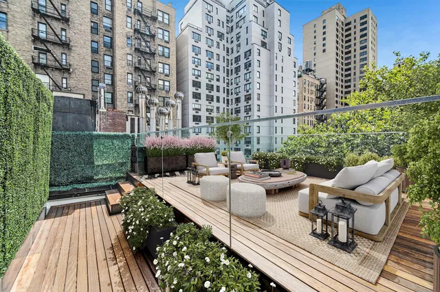a view of balcony with outdoor seating and plants